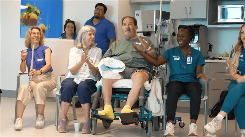 AdventHealth patient and family with staff members