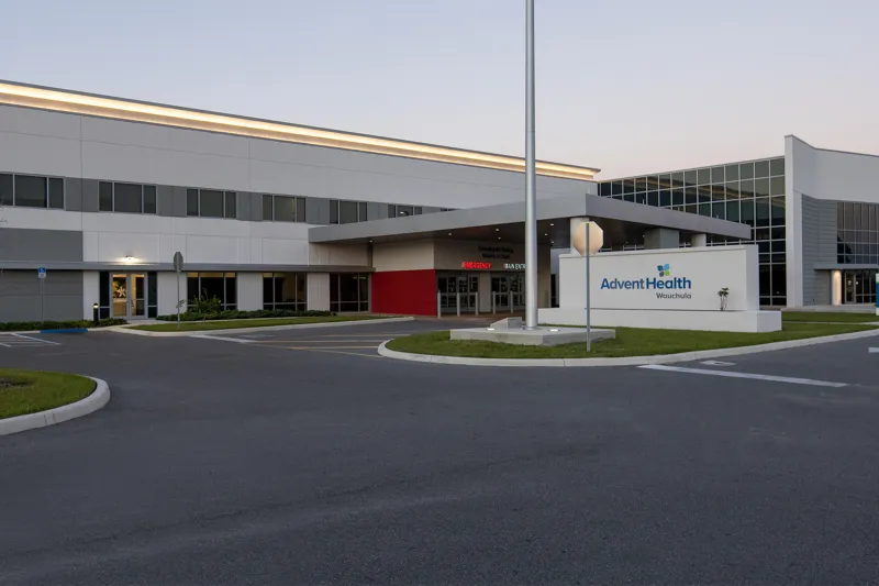 Exterior of AdventHealth Wauchula at dusk.