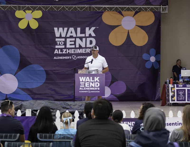 Craig Brubaker speaks before audience at Walk to End Alzheimer's