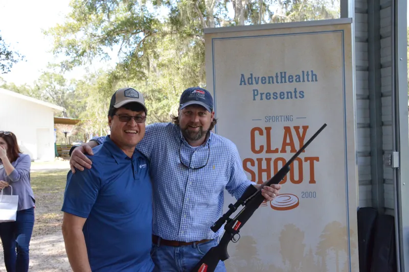 two men holding a gun