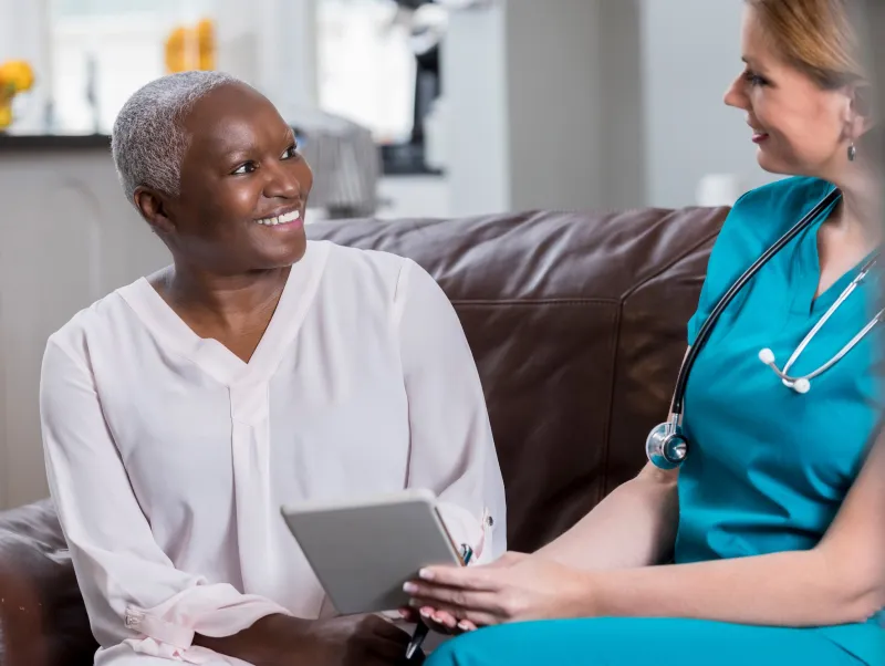 A woman reviews her test results with her doctor.