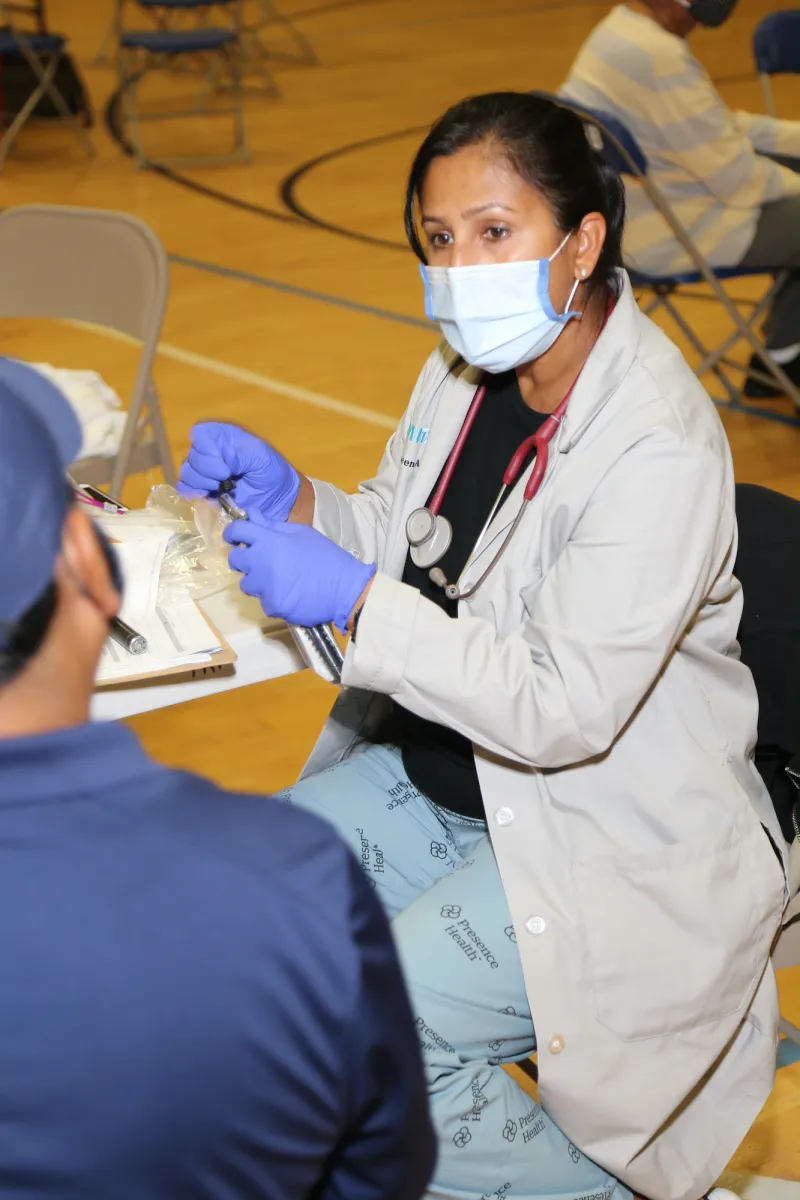 Female physician in face mask.