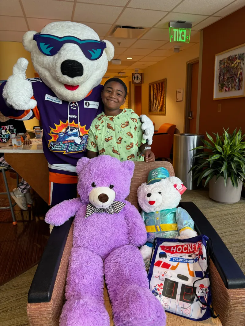 Orlando Solar Bears mascot with fan