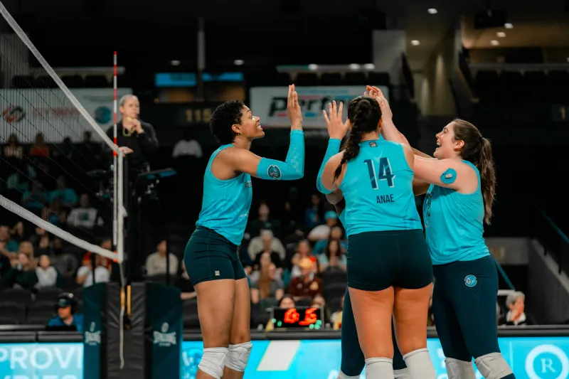 Orlando Valkyries team members hi-five