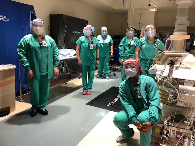 Physicians wearing face shields