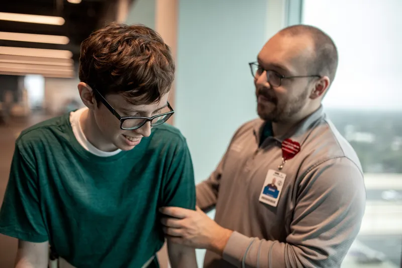 A boy at a Sport Medicine and Rehab appointment with a specialist.